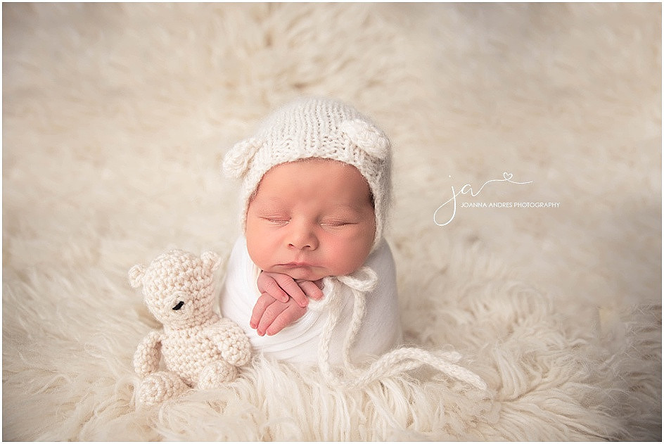 Newborn Baby Boy wrapped in all whites