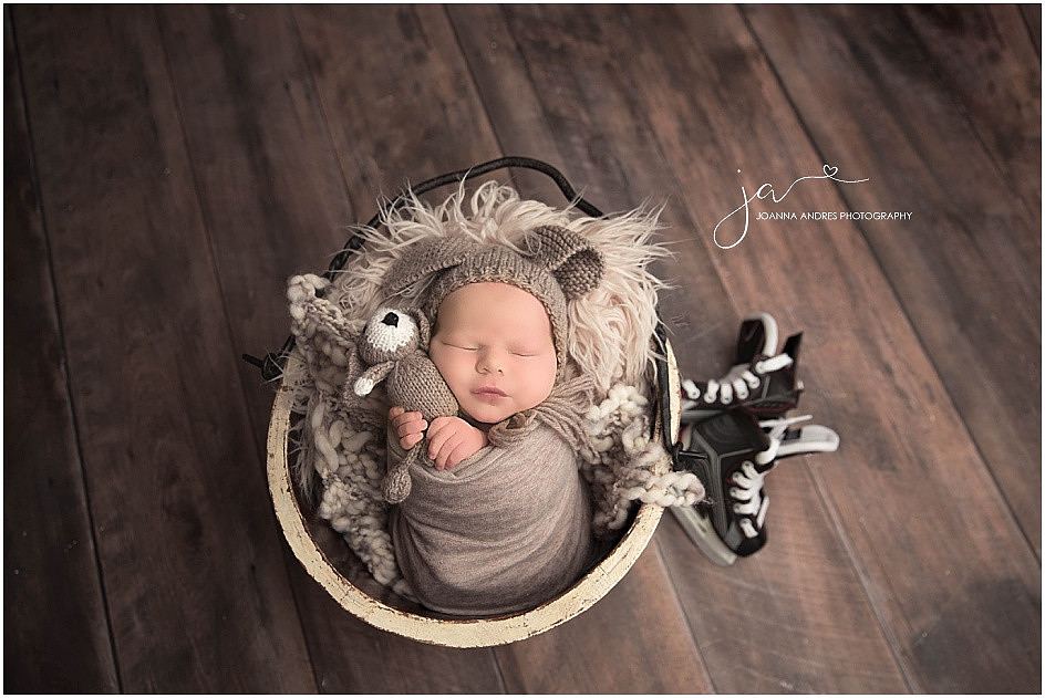 Future Hockey Player NEwborn Baby Boy Posed with Hockey Skates