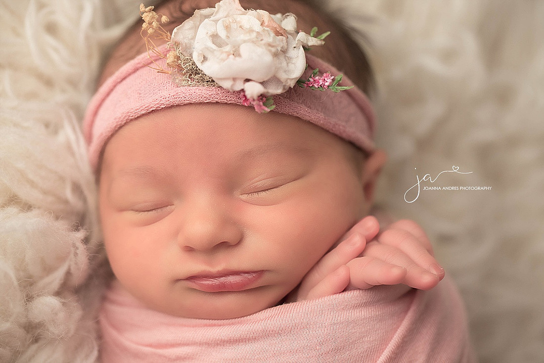 Baby Girl Close Up Wrapped in Pink