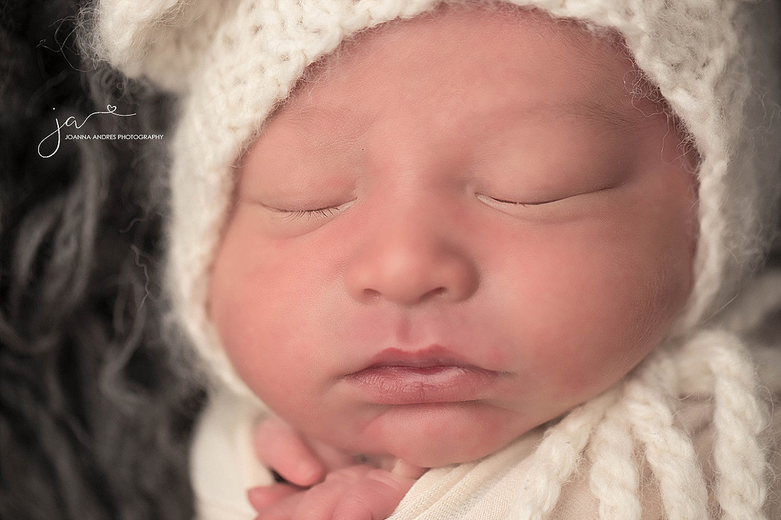 Close Up of Baby Boy with White Bear Bonnet