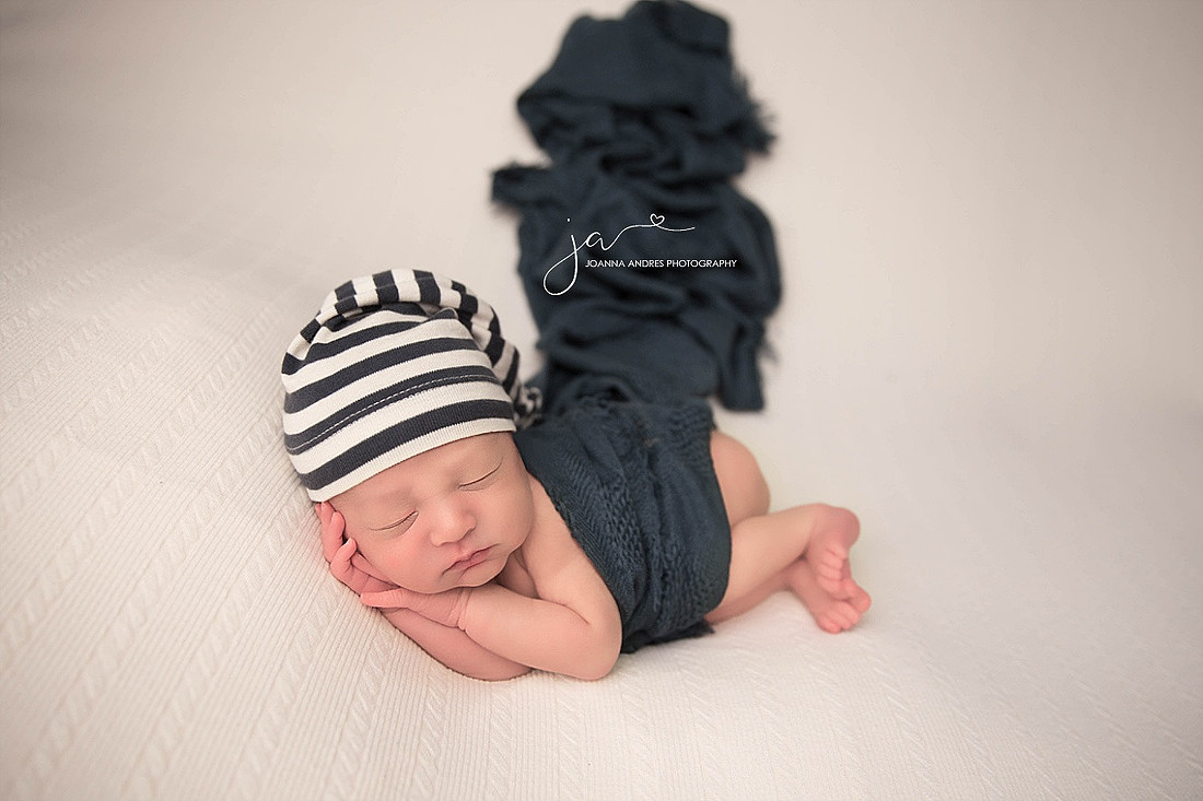 Baby Boy wrapped in Navy Blue with Navy Blue and white striped hat