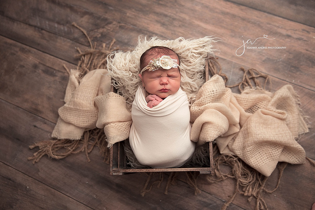 Newborn Baby Girl in Prop dressed in Neutrals