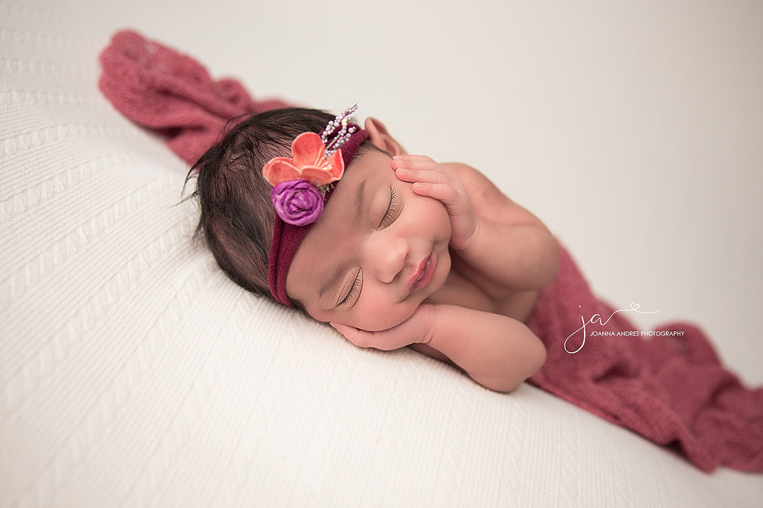 Baby GIrl with hands on cheeks