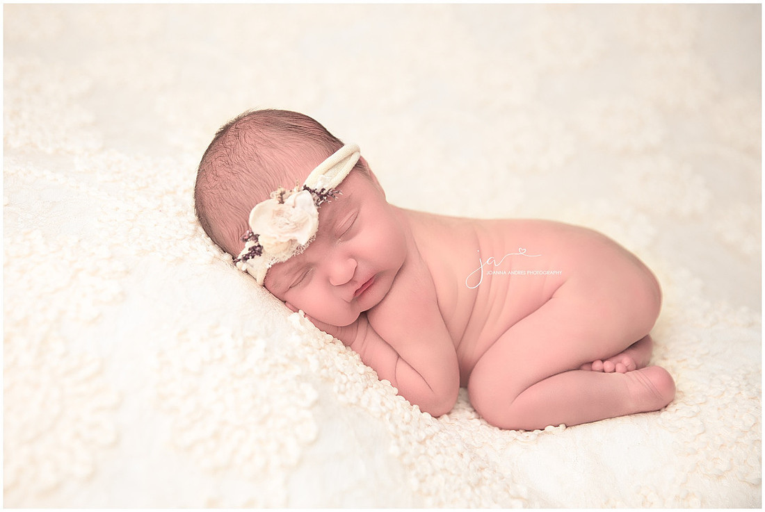 Newborn Baby in Creams and yellow headband bum up