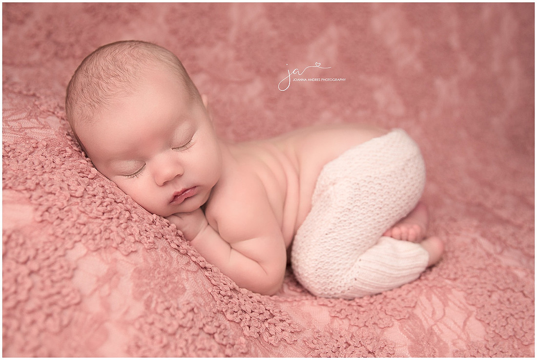 Newborn Girl in Bum Up Pose with Pink Pants