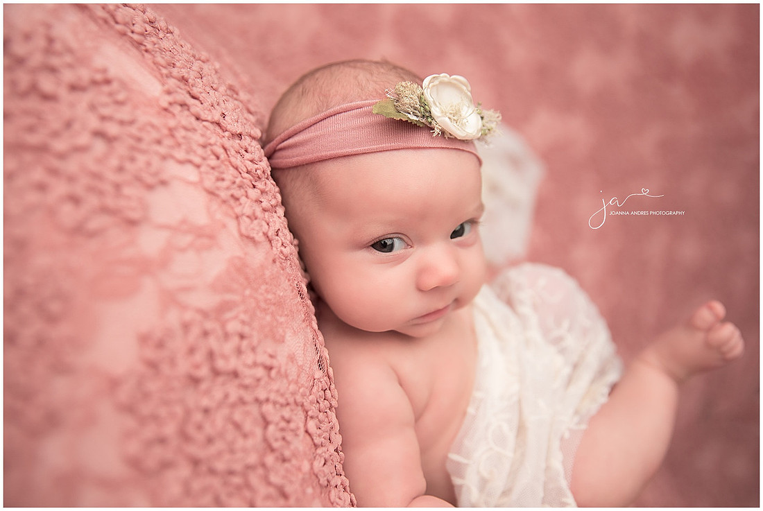 Newborn Baby Girl giving me a smirk