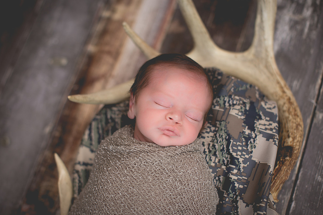 Baby Boy with Dad's Deer Antlers