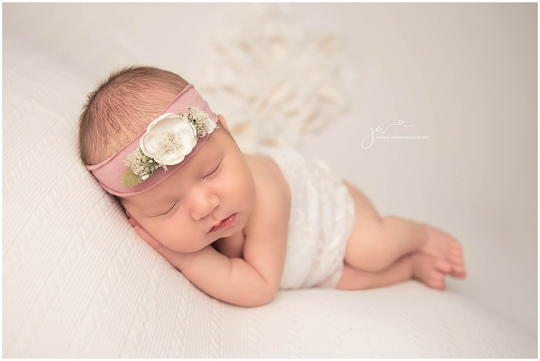 Newborn Baby Girls Side Laying Pose in Creams