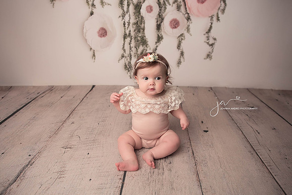 Baby Girl in Cute Pink Romper