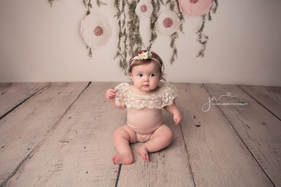 Baby Girl in Cute Pink Romper