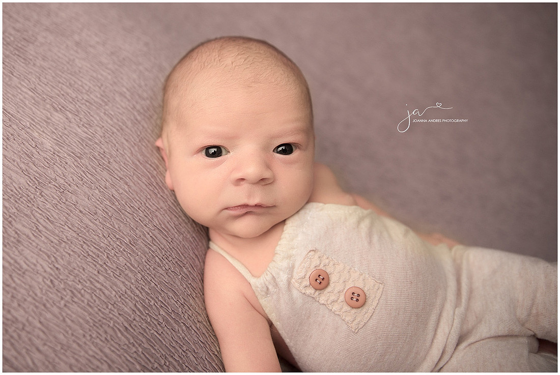 Baby Braxton with neutral outfit with eyes open