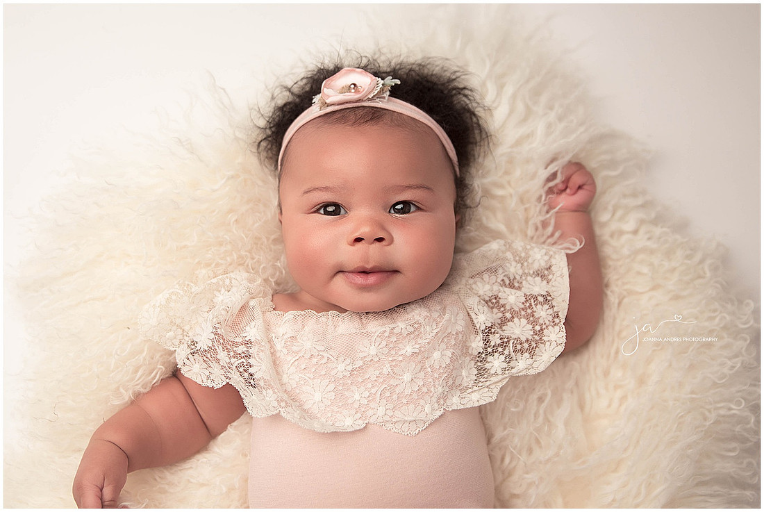 Baby Raelynn laying on back