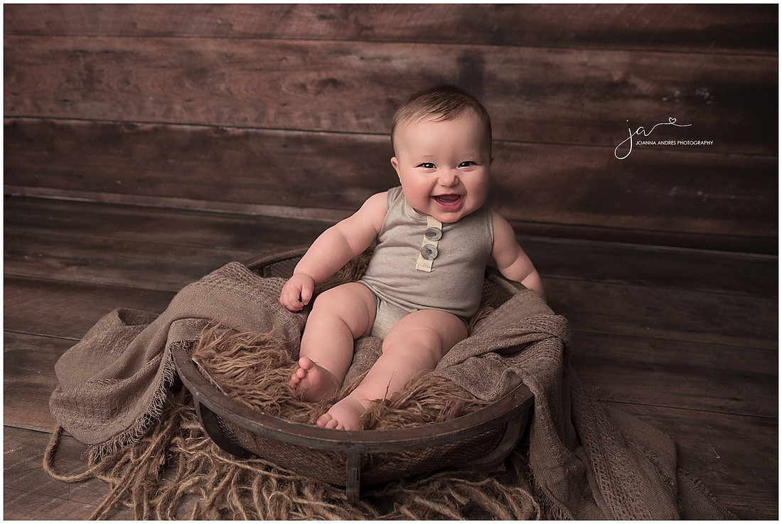 Baby Grayson in a basket