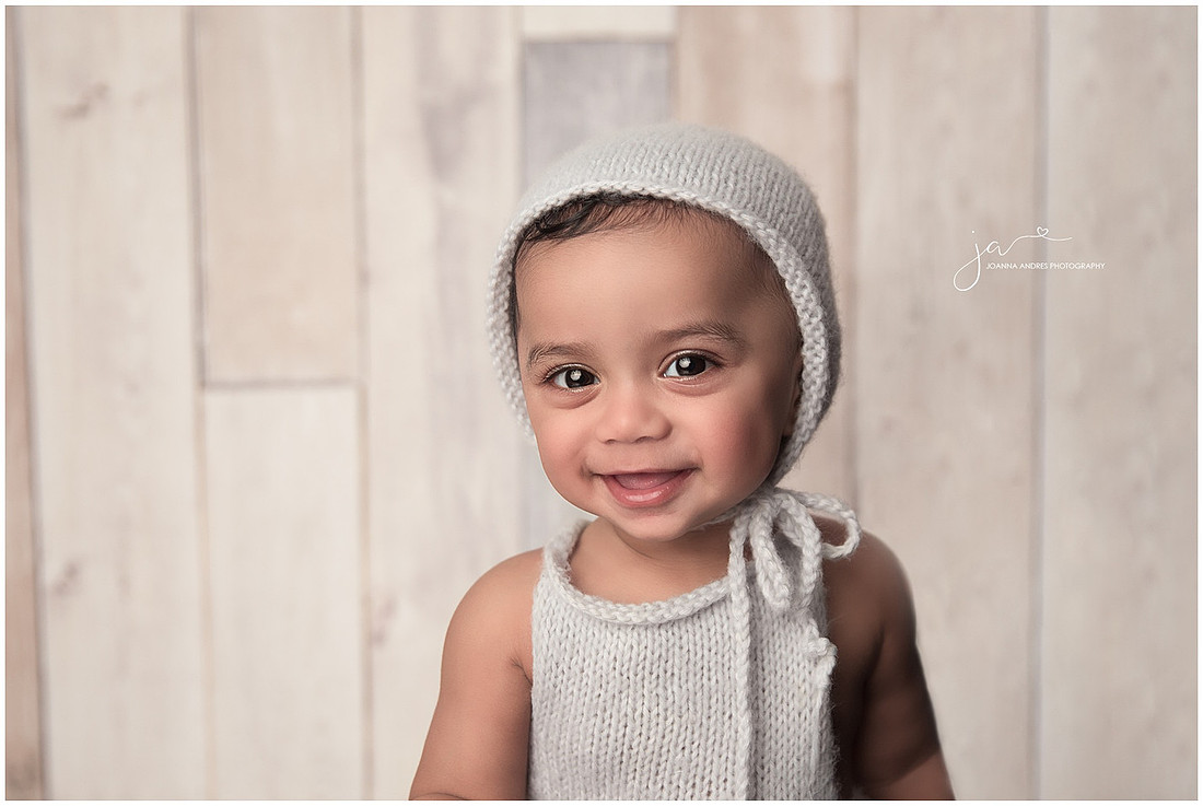 Baby Boy in Blue Bonnet all smiles