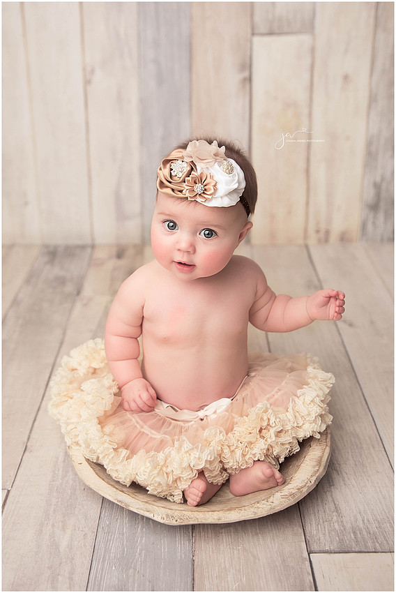 Baby Girl Sitting in a Bowl in creams