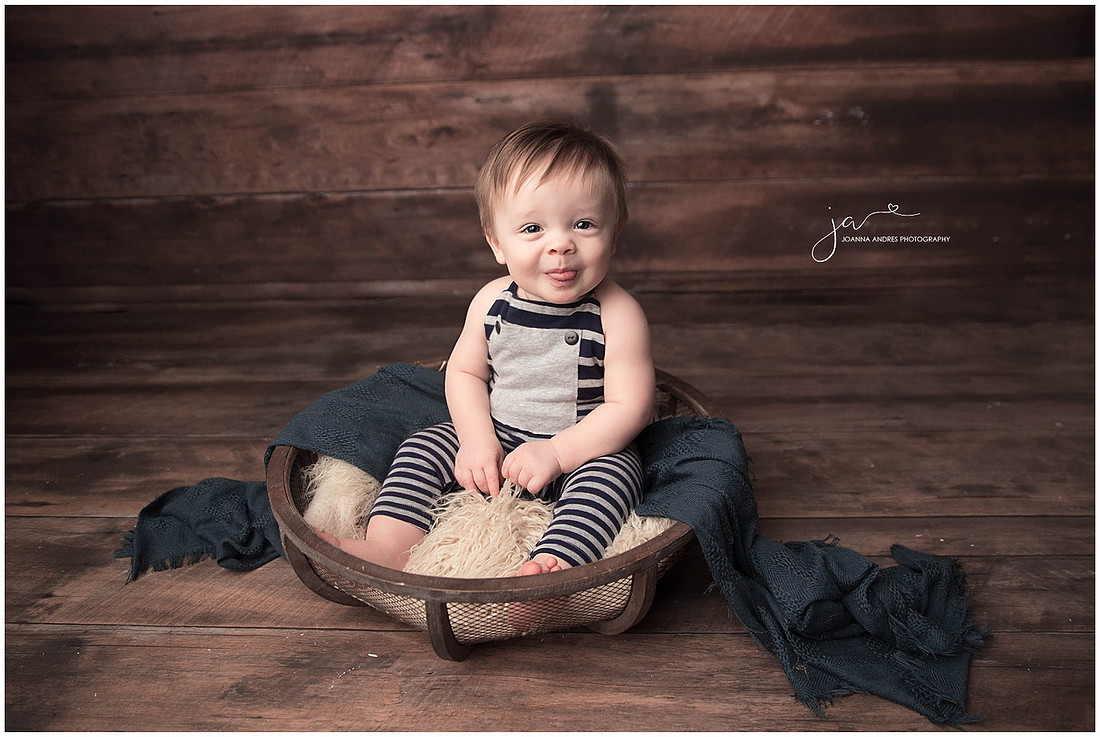 Baby Boy in basket smiling