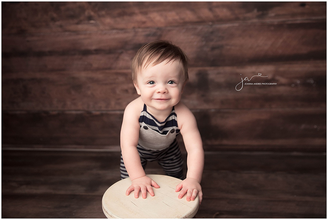 Baby Boy leaning on stool