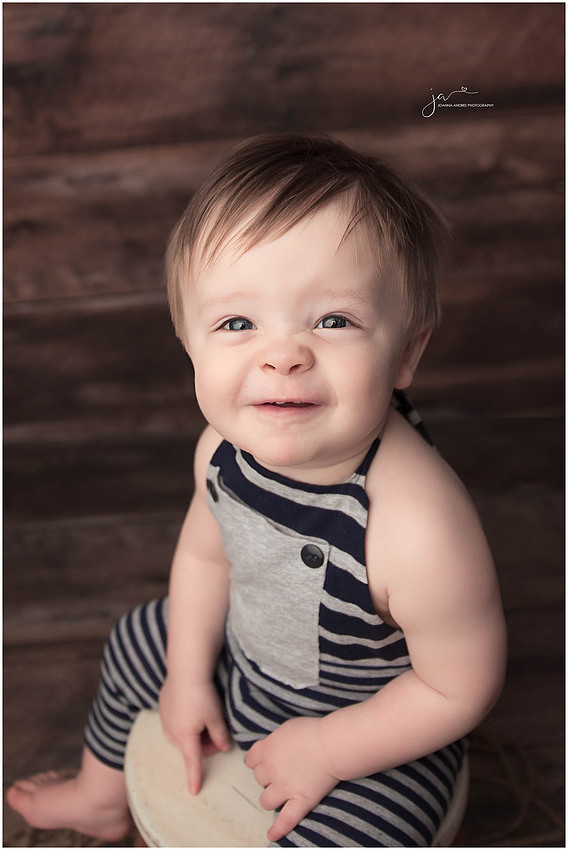 Close up Baby Boy smiling and scrunching up nose