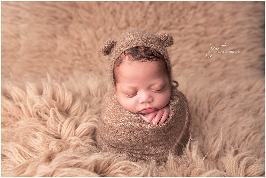 Baby Markeith wrapped in Browns with a Teddy Bear Bonnet