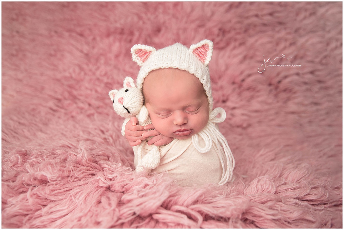 Baby Payton wrapped in White and Pink Flokati Rug