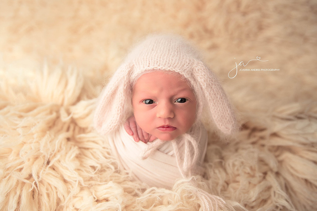 Newborn with Puppy Ears baby eyes is open