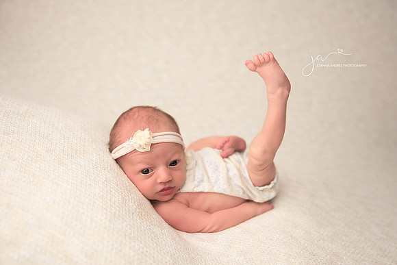 Newborn Baby Girl Huck Finn Pose with eyes open and posted toes