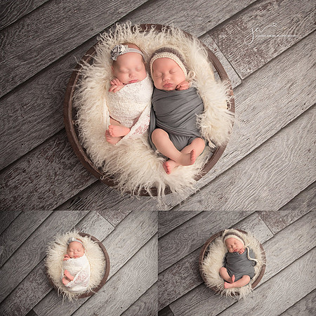 Twin Newborns girl wrapped in white and boy wrapped in dark gray