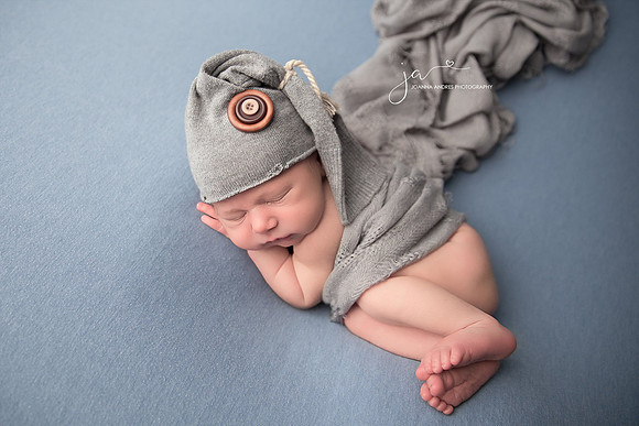 Newborn Baby Boy with Gray Hat and Gray Wrap