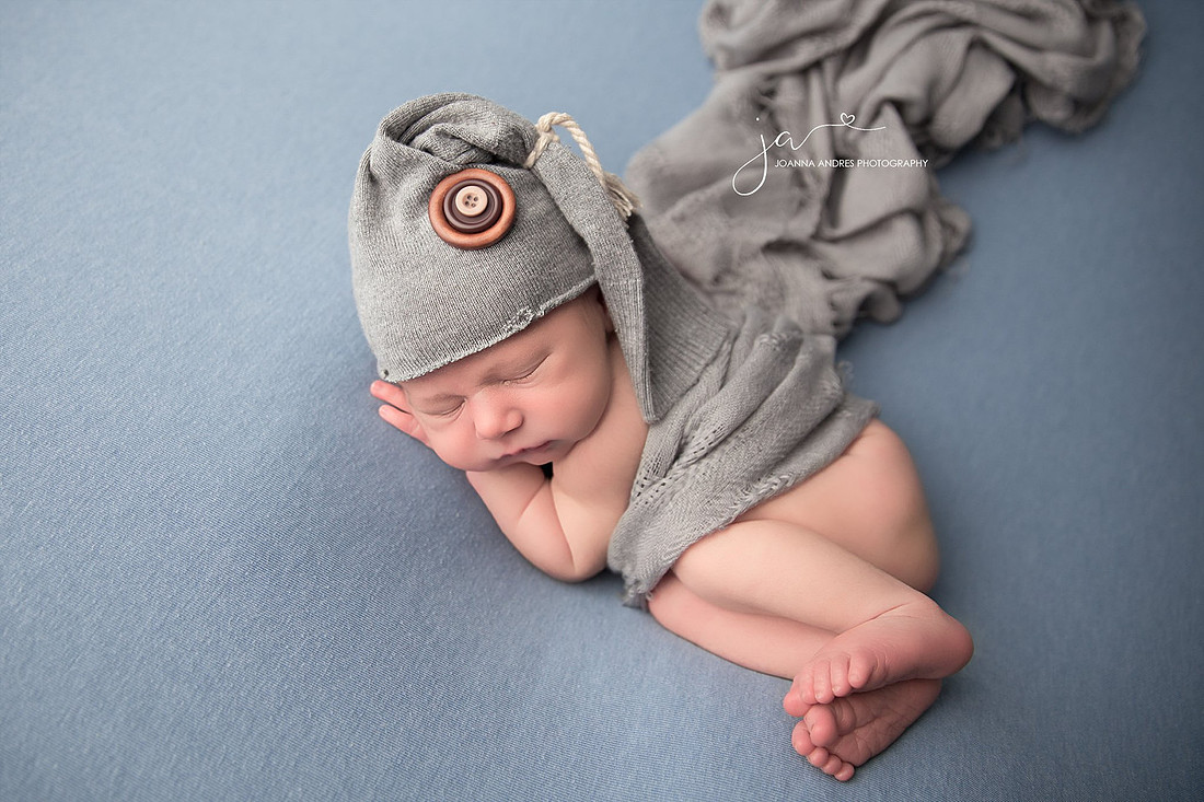 Newborn Baby Boy with Gray Hat and Gray Wrap