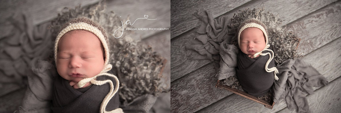 Newborn Baby Boy in prop wrapped in dark gray