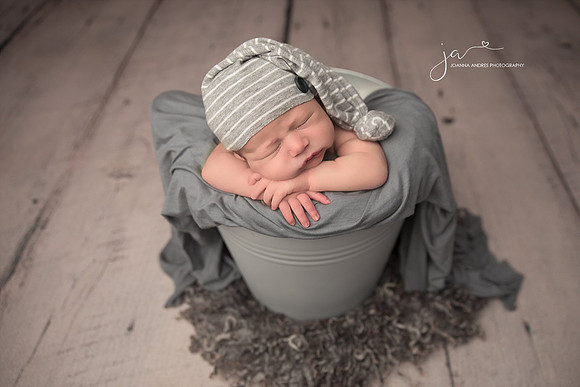 Newborn Baby Boy in Gray Bucket
