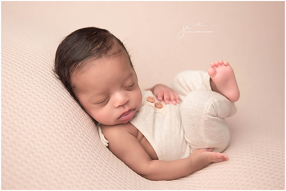Baby in neutrals huck finn pose