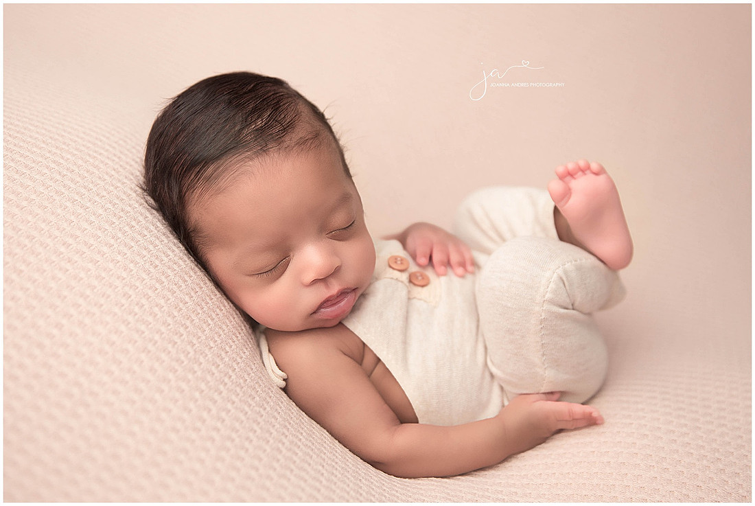 Baby in neutrals huck finn pose