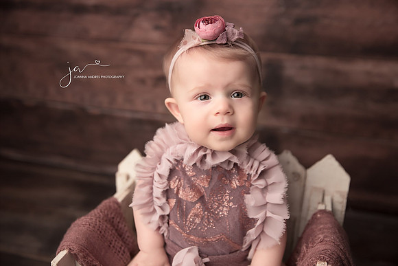Close up of Baby Girl dressed in Mauves