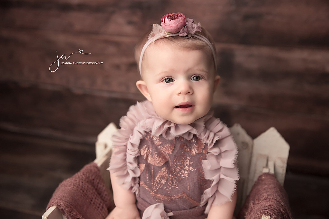 Close up of Baby Girl dressed in Mauves