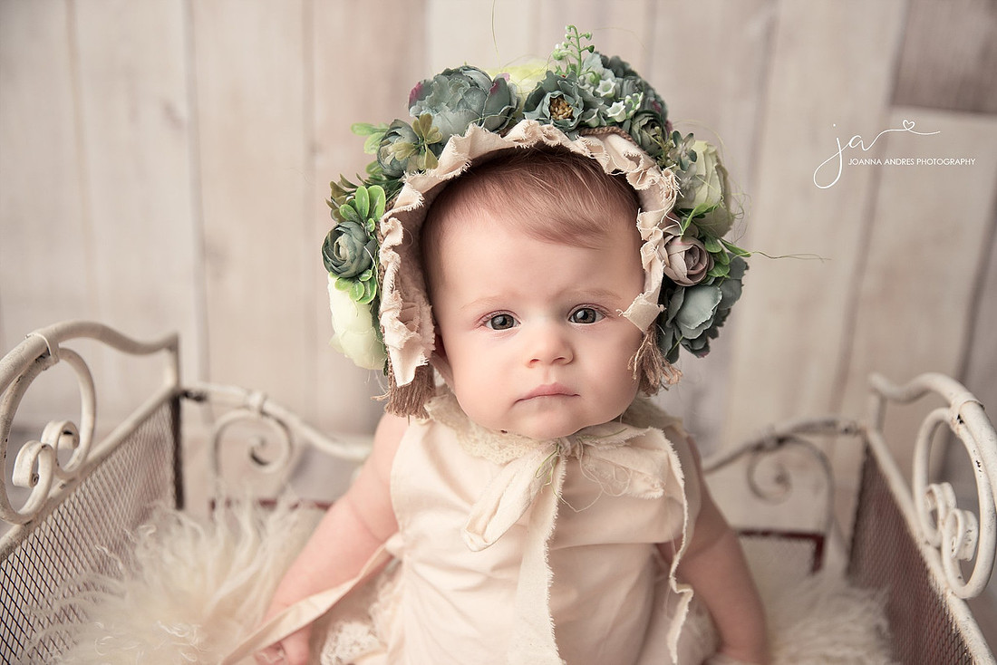 Baby Girl with Flower Bonnet