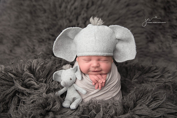 Newborn Baby Boy in Elephant Hat Smiling