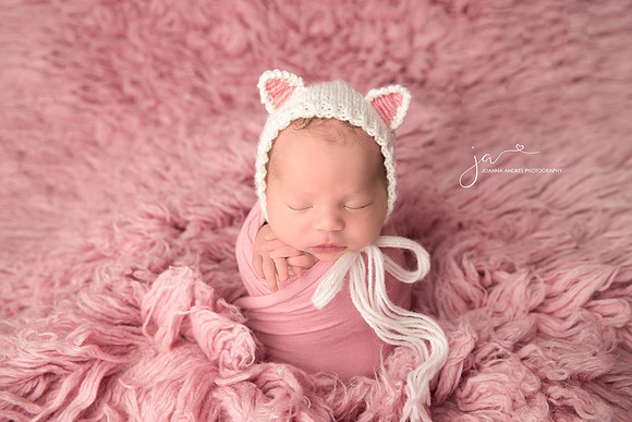 Baby Girl Potato Sack pose in pink and white bonnet