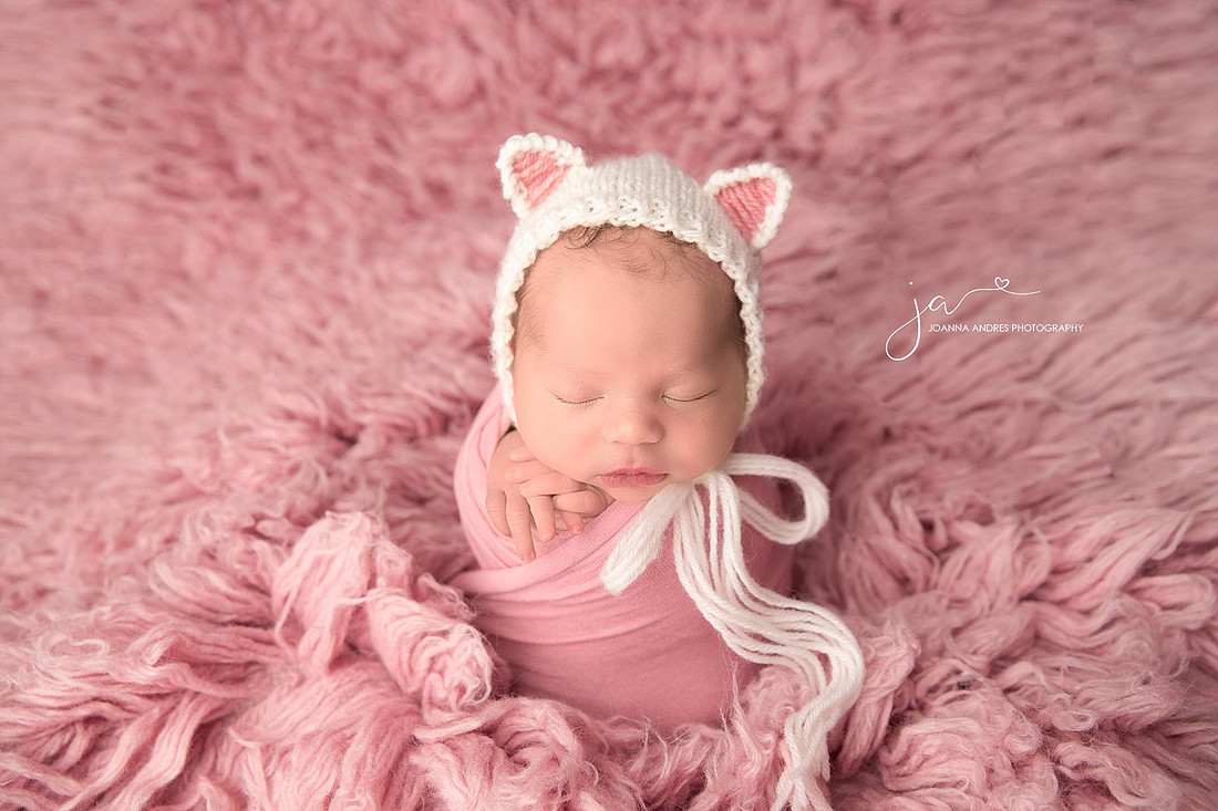 Baby Girl Potato Sack pose in pink and white bonnet
