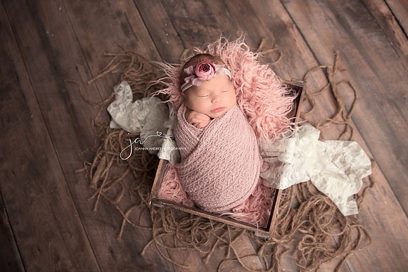 Baby Girl wrapped up and in a prop