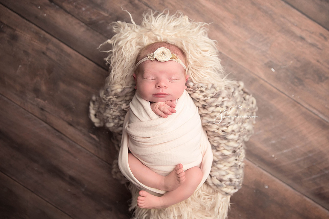 Nweborn Baby Girl wrapped in white