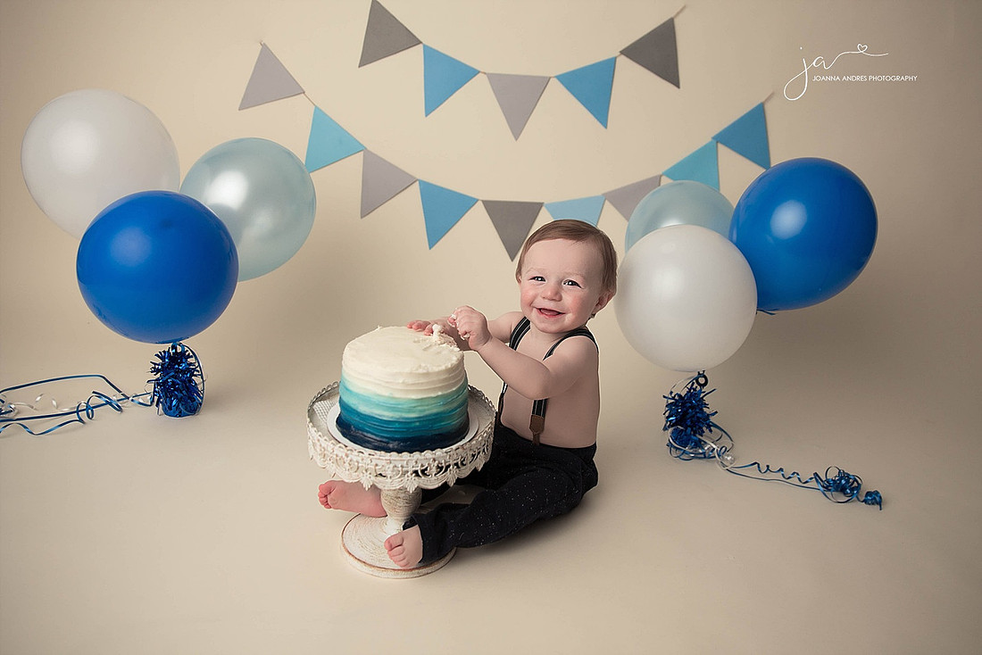 One Year Cake Smash Boy Smiling with Cake