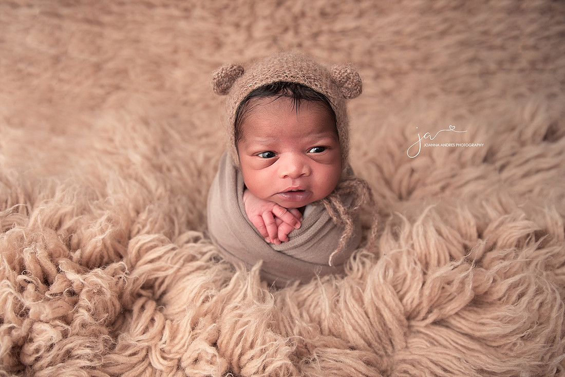 Newborn Baby Boy wrapped in browns