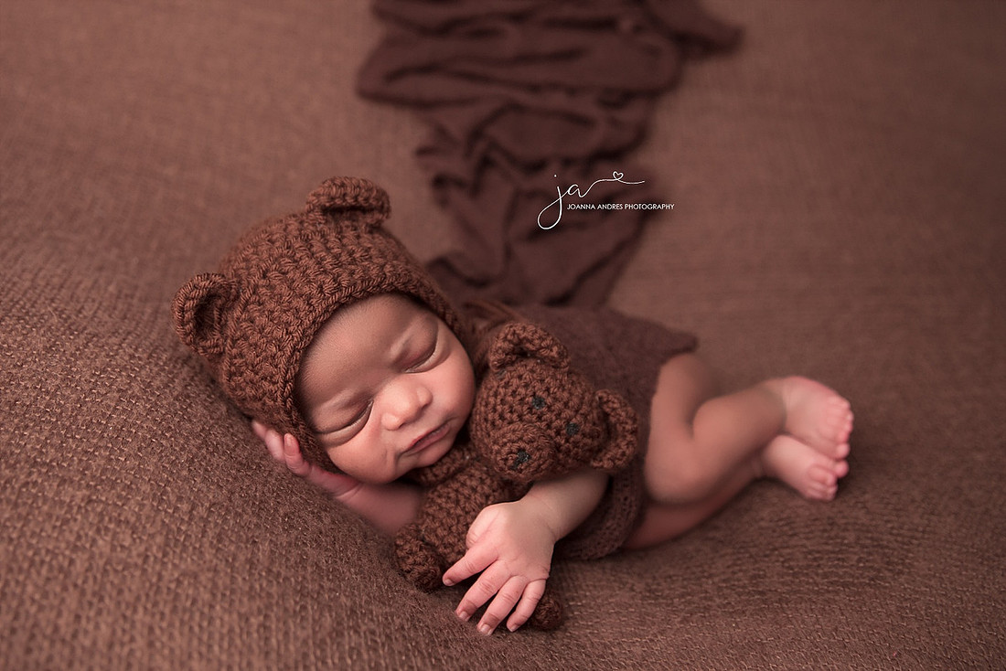Newborn Baby Boy Side Laying Pose with Teddy Bear