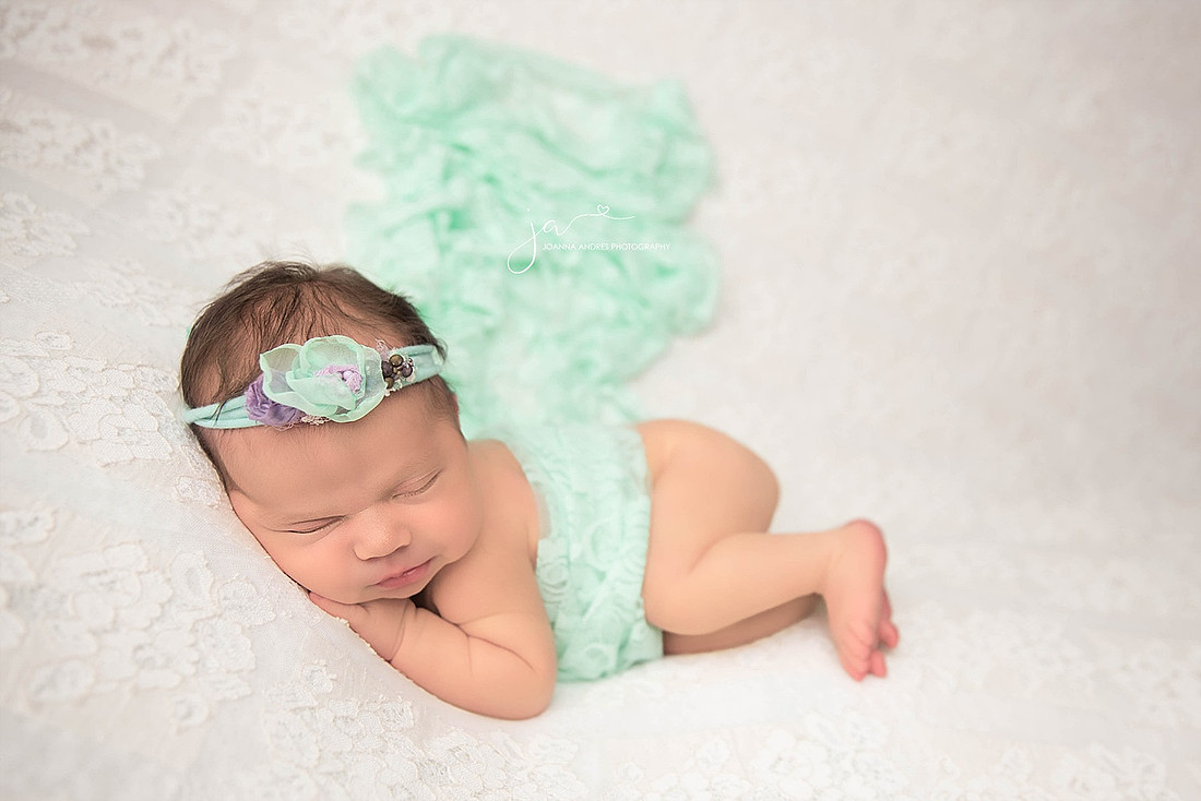 Baby GIrl with teal blanket for a pop of color