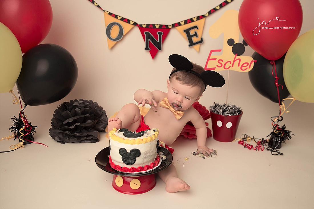 Birthday Boy putting toes in cake mickey theme