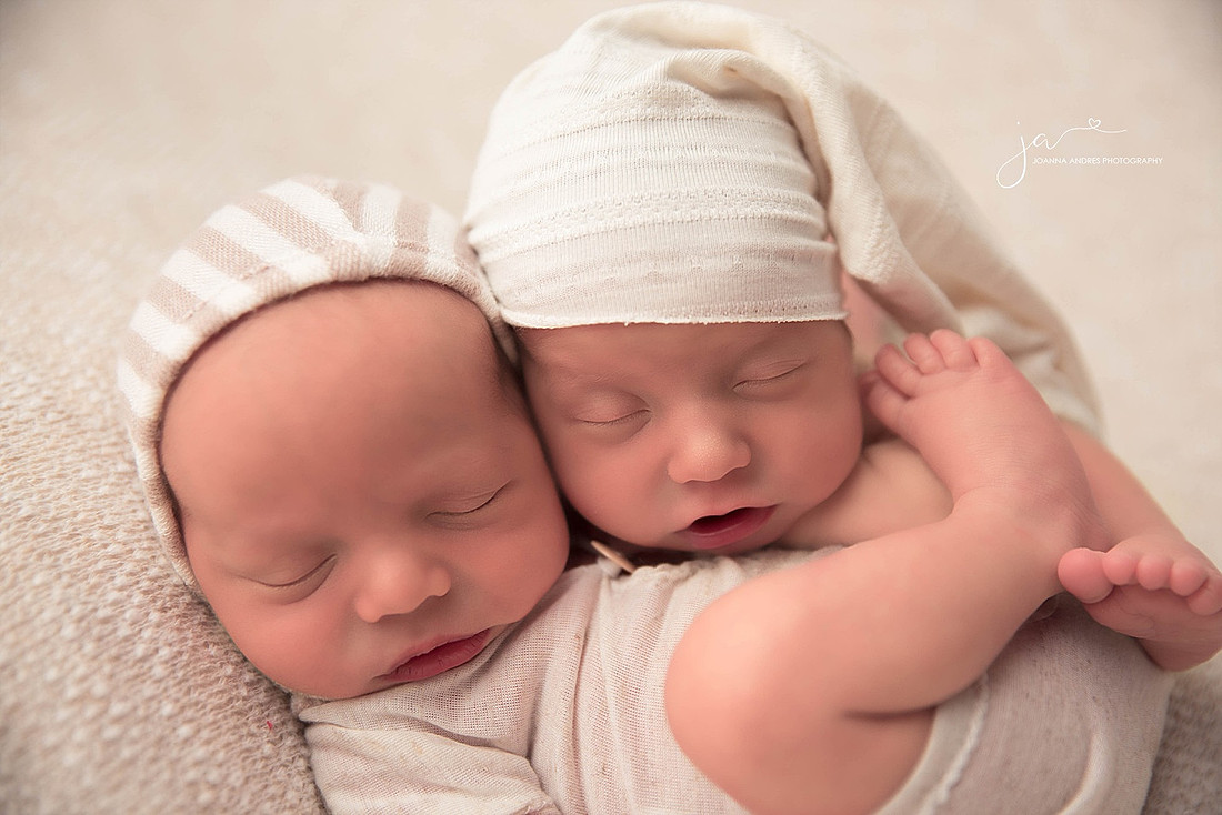 Twin Newborns in neutrals close up