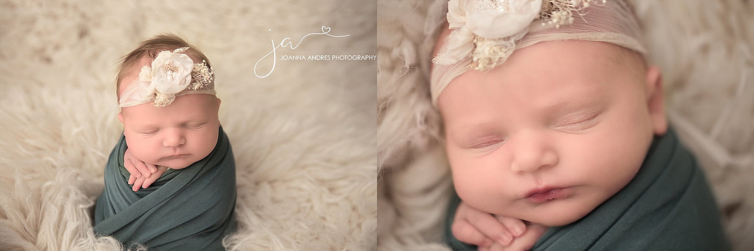 Newborn Baby wrapped in Blue with a cream flowered headband