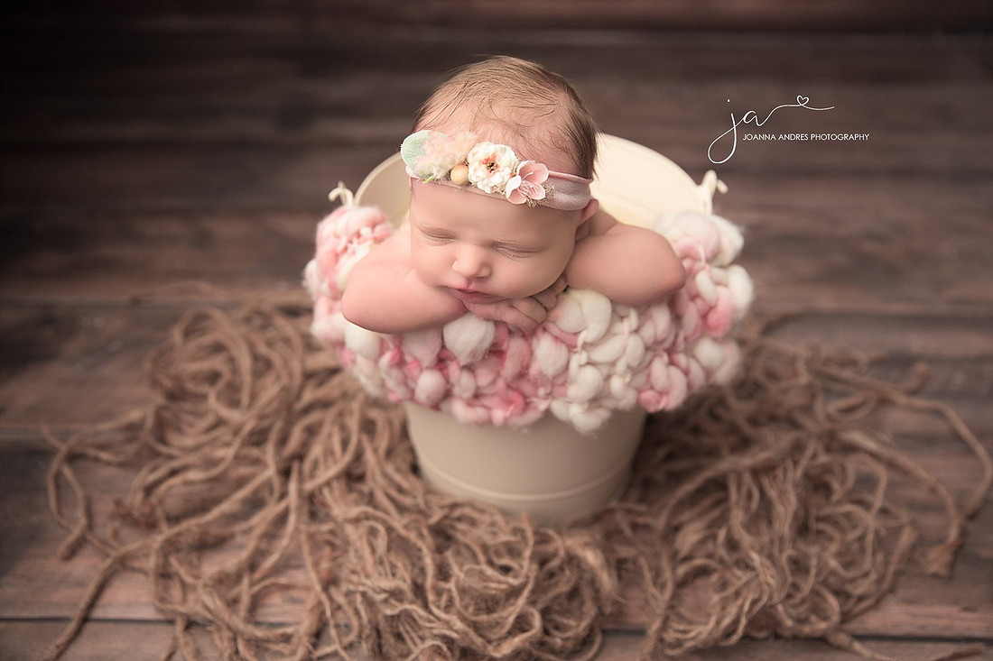 Baby in  Bucket with Creams and Pinks