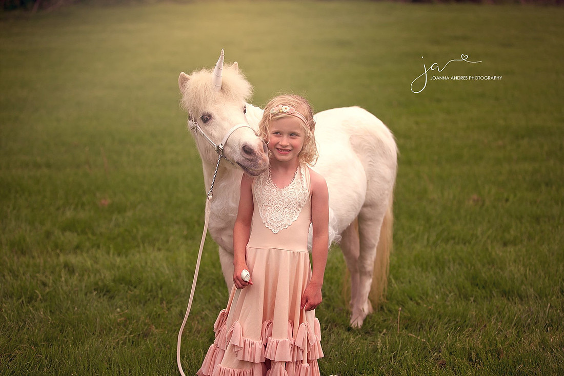 Unicorn Kissing LIttle Girls Face